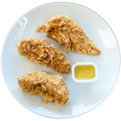 Chicken tenders with a pot of dipping sauce